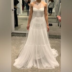 Halter neck/tiered skirt wedding dress.